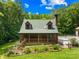 Charming home featuring a cozy front porch, well-maintained lawn, and private garden area at 485 Johnson St, China Grove, NC 28023