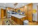 Open kitchen with wooden cabinets, a spacious island, and stainless steel appliances at 485 Johnson St, China Grove, NC 28023