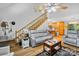 Inviting living room with hardwood floors and staircase leading to the upper level, adjacent to an open kitchen at 485 Johnson St, China Grove, NC 28023