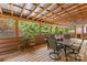 Enclosed porch, perfect for entertaining, features wood floors and views of the surrounding greenery at 485 Johnson St, China Grove, NC 28023