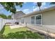 Well-maintained backyard featuring a wooden deck, concrete patio, and lush green lawn at 4894 Prowess Ln, Indian Land, SC 29707