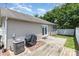 Cozy backyard with a wooden deck, concrete patio and manicured lawn for outdoor enjoyment at 4894 Prowess Ln, Indian Land, SC 29707