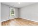 A well-lit bedroom offers ample space and a window with backyard views at 4894 Prowess Ln, Indian Land, SC 29707