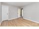 This bedroom has wood floors and a doorway leading to a full bathroom at 4894 Prowess Ln, Indian Land, SC 29707