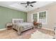 A spacious bedroom includes a ceiling fan, large window, and a desk at 4894 Prowess Ln, Indian Land, SC 29707