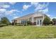 Exterior view of the community clubhouse with manicured landscaping and ample lawn space at 4894 Prowess Ln, Indian Land, SC 29707