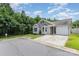 Exterior shot showcases the home's manicured lawn, driveway, and inviting curb appeal at 4894 Prowess Ln, Indian Land, SC 29707