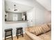 Open kitchen space with breakfast bar, pendant lighting, and stainless steel appliances at 4894 Prowess Ln, Indian Land, SC 29707