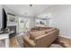 Cozy living room with fireplace, hardwood floors, and ample natural light at 4894 Prowess Ln, Indian Land, SC 29707