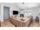Bright living room with fireplace, vaulted ceilings, and hardwood floors at 4894 Prowess Ln, Indian Land, SC 29707