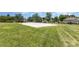 Community sand volleyball court surrounded by well-maintained lawns and mature trees at 4894 Prowess Ln, Indian Land, SC 29707