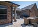 An inviting patio with a hot tub, grill, and a cozy seating area with a fire pit table at 5268 Courtyard Ln, Belmont, NC 28012
