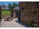 Spacious backyard patio with a seating area, grill, and view of the backyard at 5268 Courtyard Ln, Belmont, NC 28012