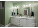 Bathroom offers dual sinks, spacious vanity, and decorative mirrors at 5268 Courtyard Ln, Belmont, NC 28012