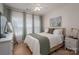 Bedroom with a large window, soft lighting, and a neutral color scheme at 5268 Courtyard Ln, Belmont, NC 28012