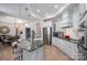 Open kitchen features a large island, granite countertops, stainless appliances and hardwood flooring at 5268 Courtyard Ln, Belmont, NC 28012