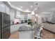 Modern kitchen with white cabinets, granite countertops, and stainless steel appliances at 5268 Courtyard Ln, Belmont, NC 28012