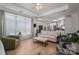 Bright living room open to kitchen with natural light, hardwood floors, and comfortable furnishings at 5268 Courtyard Ln, Belmont, NC 28012