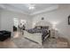 Spacious Primary bedroom with hardwood floors, ceiling fan and view into office space at 5268 Courtyard Ln, Belmont, NC 28012