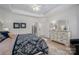 Primary bedroom features hardwood floors, a ceiling fan and a large dresser at 5268 Courtyard Ln, Belmont, NC 28012