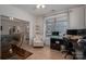 Bright office features a large window, hardwood floors, and space for desk and chair at 5268 Courtyard Ln, Belmont, NC 28012