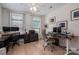 Spacious office area with dual desks, large windows, and ample lighting at 5268 Courtyard Ln, Belmont, NC 28012