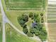Aerial view of a house surrounded by farmland and lush greenery at 550 Woodleaf Barber Rd, Cleveland, NC 27013