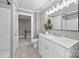 Updated bathroom with marble vanity, modern lighting, and neutral finishes, open to the bedroom and hall at 550 Woodleaf Barber Rd, Cleveland, NC 27013