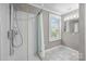 Bathroom featuring a glass door shower, neutral walls, and tiled floors at 550 Woodleaf Barber Rd, Cleveland, NC 27013