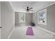 Comfortable bedroom with natural light, ceiling fan, and ample space for exercise equipment or furniture at 550 Woodleaf Barber Rd, Cleveland, NC 27013