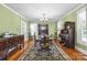 Bright dining room boasting hardwood floors, an antique buffet, and a chandelier at 550 Woodleaf Barber Rd, Cleveland, NC 27013