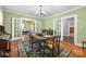The dining room has a wood table and chairs, a buffet, and hardwood floors at 550 Woodleaf Barber Rd, Cleveland, NC 27013