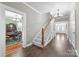 Spacious foyer featuring hardwood floors, a chandelier, and a view into the dining room at 550 Woodleaf Barber Rd, Cleveland, NC 27013