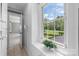 Bright hallway and view to backyard with built in storage at 550 Woodleaf Barber Rd, Cleveland, NC 27013