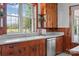 Rustic kitchen featuring wood cabinets and a stainless steel dishwasher at 550 Woodleaf Barber Rd, Cleveland, NC 27013