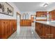 This expansive kitchen features wood paneling, white countertops, and tile floors at 550 Woodleaf Barber Rd, Cleveland, NC 27013