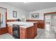 The spacious kitchen showcases wood paneling, white countertops, and tile flooring at 550 Woodleaf Barber Rd, Cleveland, NC 27013