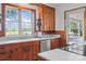 Cozy kitchen with wood cabinets, a new dishwasher, and lots of light at 550 Woodleaf Barber Rd, Cleveland, NC 27013