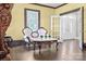 Living room featuring vintage furniture, hardwood floors, and front door view at 550 Woodleaf Barber Rd, Cleveland, NC 27013