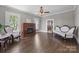 Classic living room with hardwood floors, fireplace, ceiling fan, and neutral wall paint at 550 Woodleaf Barber Rd, Cleveland, NC 27013