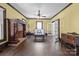 Spacious living room with original hardwood floors and decorative brick fireplace at 550 Woodleaf Barber Rd, Cleveland, NC 27013