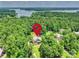 Aerial view of a secluded home nestled in lush greenery, near a scenic lake at 631 May Green Dr, Clover, SC 29710