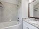 Bathroom featuring a shower-tub combination, granite vanity and gray tiling at 631 May Green Dr, Clover, SC 29710