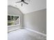 Bright bedroom with vaulted ceiling, plush carpeting, and a large window at 631 May Green Dr, Clover, SC 29710