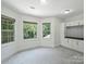 Well-lit room featuring windows, cabinets, and wall to wall carpeting at 631 May Green Dr, Clover, SC 29710