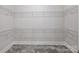 Walk-in closet featuring white wire shelving and gray tile flooring at 631 May Green Dr, Clover, SC 29710