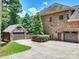 Brick house exterior showcasing a large garage with multiple bays and a stone-accented secondary garage at 631 May Green Dr, Clover, SC 29710