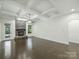 Expansive living room with dark floors, a stone fireplace, and coffered ceilings at 631 May Green Dr, Clover, SC 29710