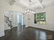 Elegant living room featuring dark wood floors, crown molding, and large windows at 631 May Green Dr, Clover, SC 29710