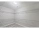 Spacious walk-in closet with carpet and built-in metal shelving for optimal storage at 631 May Green Dr, Clover, SC 29710